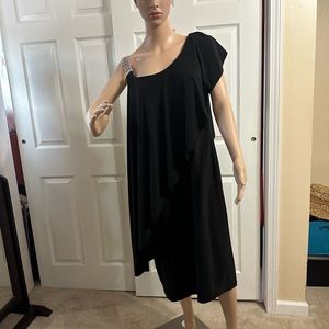 Elegant black dress with jeweled right shoulder.